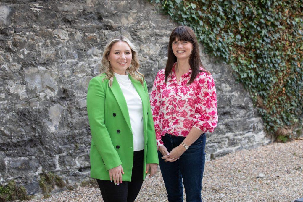 Company Appointments Photography creative lifestyle portrait of two female company directors with stone wall background