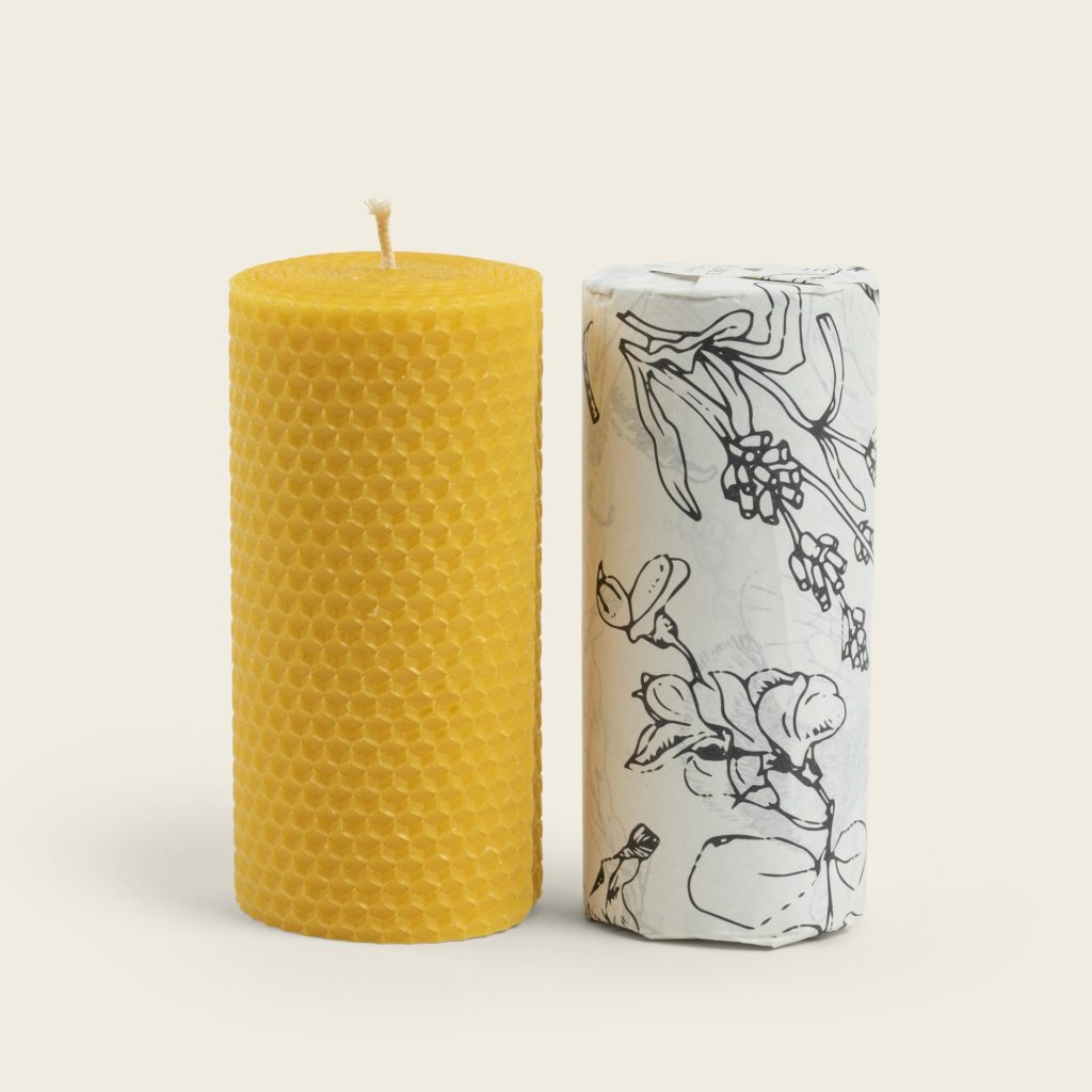 Beeswax candle alongside candle in tissue paper Product Photography Studio Dublin &Open