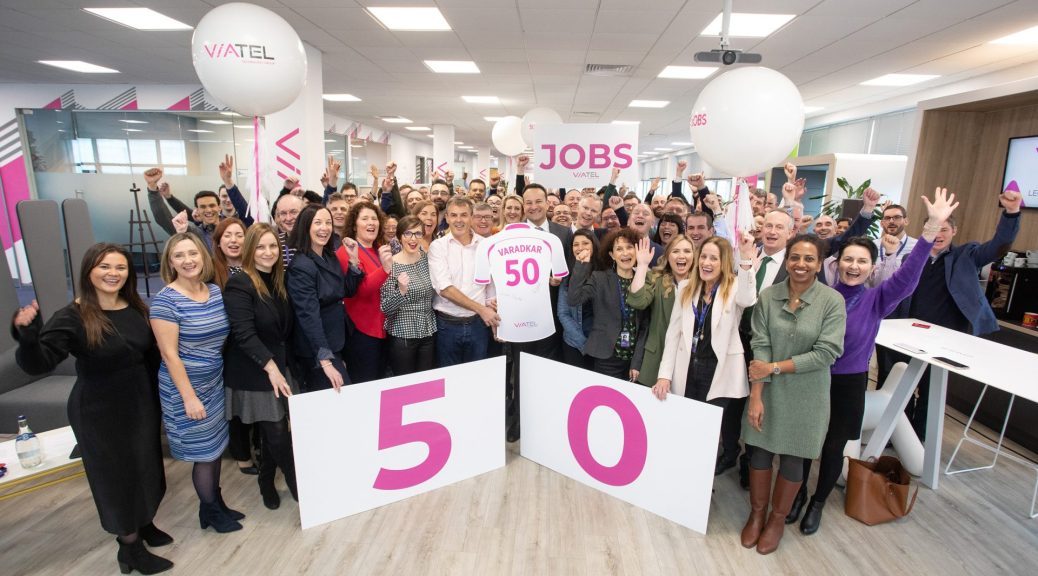 Photocall Photographer Dublin Viatel Press launch with An Taoiseach Leo Varadkar to announce 50 new jobs. Large group shot in corporate office holding signs and balloons